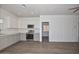 Stylish living space featuring a full kitchen, hardwood floors, and ample natural light at 3831 N 8Th St, Phoenix, AZ 85014