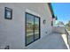 A covered patio provides a space to relax, with tile flooring and a sliding glass door to inside at 3831 N 8Th St, Phoenix, AZ 85014