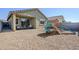 Spacious backyard with covered patio and room for Gathering play at 40060 W Wade Dr, Maricopa, AZ 85138