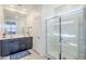 Bright bathroom features a double vanity and a glass-enclosed shower at 40060 W Wade Dr, Maricopa, AZ 85138