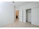 This bedroom features a closet and an open doorway to an en-suite bathroom at 40060 W Wade Dr, Maricopa, AZ 85138