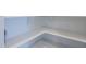 Walk-in pantry with ample shelving offers plenty of storage space for dry goods and kitchen essentials at 40060 W Wade Dr, Maricopa, AZ 85138