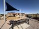 Community playground featuring play structures, shade, and seating areas for Gathering enjoyment at 40060 W Wade Dr, Maricopa, AZ 85138