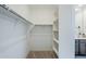 Spacious walk-in closet featuring shelving and plenty of storage space at 40060 W Wade Dr, Maricopa, AZ 85138