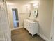 Bathroom featuring double sink vanity, framed mirrors, tile floor, and access to the shower at 4303 E Cactus Rd # 135, Phoenix, AZ 85032