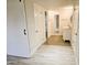 Bathroom with double vanities, framed mirrors, tile floors and sliding barn door at 4303 E Cactus Rd # 135, Phoenix, AZ 85032