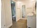 Bathroom featuring double sink vanity, framed mirrors, tile floor, and access to the shower at 4303 E Cactus Rd # 135, Phoenix, AZ 85032