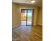 Bedroom with laminate flooring and sliding glass door to the outside patio at 4303 E Cactus Rd # 135, Phoenix, AZ 85032