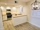 Bright kitchen with updated appliances, granite countertops, and shaker-style cabinets at 4303 E Cactus Rd # 135, Phoenix, AZ 85032