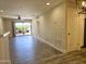 Bright living room showcasing tile floors, recessed lighting and sliding glass door to patio at 4303 E Cactus Rd # 135, Phoenix, AZ 85032
