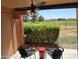 Comfortable patio area with ceiling fan and golf course views at 4303 E Cactus Rd # 135, Phoenix, AZ 85032
