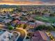 Picturesque aerial shot of homes and a golf course, showcasing the community's inviting streetscapes and lush landscaping at 4906 S Verbena Ave, Gilbert, AZ 85298