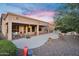 Expansive backyard with a covered patio, outdoor kitchen, and desert landscaping, perfect for outdoor living at 4906 S Verbena Ave, Gilbert, AZ 85298