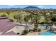 An aerial view of the clubhouse showing palm trees, a pool, and a golf course at 4906 S Verbena Ave, Gilbert, AZ 85298