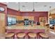 Open kitchen featuring granite countertops, stainless steel appliances, and a breakfast bar with seating at 4906 S Verbena Ave, Gilbert, AZ 85298