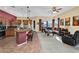 Open-concept living space seamlessly connecting the kitchen, breakfast bar, and a cozy living area at 4906 S Verbena Ave, Gilbert, AZ 85298