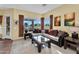 Comfortable living area featuring plush seating and expansive windows overlooking the outdoors at 4906 S Verbena Ave, Gilbert, AZ 85298