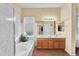 Bright bathroom with double sinks, soaking tub, shower, and vanity at 4906 S Verbena Ave, Gilbert, AZ 85298