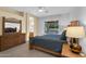 Bright primary suite with a ceiling fan, water view, and ensuite bathroom access at 4906 S Verbena Ave, Gilbert, AZ 85298