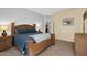 Well-lit primary suite featuring neutral walls, carpet, and light wood furniture at 4906 S Verbena Ave, Gilbert, AZ 85298