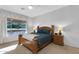 Comfortable bedroom featuring a large window and neutral decor at 4906 S Verbena Ave, Gilbert, AZ 85298