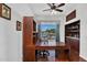 Home office with custom built-in shelving and large desk space at 4906 S Verbena Ave, Gilbert, AZ 85298