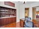 Spacious office with wood floors, built-in shelves, and a large desk at 4906 S Verbena Ave, Gilbert, AZ 85298