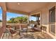 Inviting outdoor patio with comfortable seating, a welcome mat and views of the lush green landscape at 4906 S Verbena Ave, Gilbert, AZ 85298