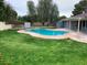 Backyard with large kidney-shaped pool at 6841 E Vista Dr, Paradise Valley, AZ 85253