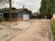 Wide driveway and garage of a single-story house, featuring desert landscaping and secure fencing at 6841 E Vista Dr, Paradise Valley, AZ 85253