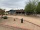 Single-story home with blue siding, a covered porch, and desert landscaping in front yard at 6841 E Vista Dr, Paradise Valley, AZ 85253