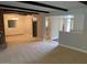 Bright, carpeted living room leading to dining and kitchen areas, ideal for entertaining at 6841 E Vista Dr, Paradise Valley, AZ 85253