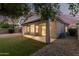The backyard features a patio, desert landscaping, and a small artificial turf area at 689 E Stottler Dr, Gilbert, AZ 85296