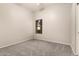 Bedroom featuring neutral paint, new carpet, and window with views of outdoors at 689 E Stottler Dr, Gilbert, AZ 85296