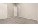 Bedroom with neutral paint, new carpet, and two white doors leading to other rooms at 689 E Stottler Dr, Gilbert, AZ 85296