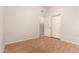 Bedroom with vinyl wood-look floors, neutral paint, and closet with sliding doors at 689 E Stottler Dr, Gilbert, AZ 85296