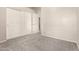 Bedroom featuring neutral paint, new carpet, and a closet with bi-fold doors at 689 E Stottler Dr, Gilbert, AZ 85296