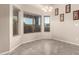 Cozy dining area with tile floors, chandelier, and large windows offering natural light at 689 E Stottler Dr, Gilbert, AZ 85296