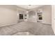 Cozy room with carpet, large windows, and neutral walls offers flexible living space at 689 E Stottler Dr, Gilbert, AZ 85296