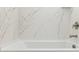 Luxurious bathroom with a sleek, white marble surround tub at 7327 W Buckhorn Trl, Peoria, AZ 85383
