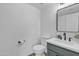 Half bathroom features a vanity with undermount sink, black hardware and stylish mirror at 745 N Dobson Rd # 144, Mesa, AZ 85201