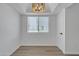 Bedroom featuring a tray ceiling, a window and a double door closet at 745 N Dobson Rd # 144, Mesa, AZ 85201