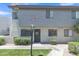 Inviting condo with desert landscaping, green grass, and mature trees at 745 N Dobson Rd # 144, Mesa, AZ 85201
