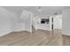 Open-concept living room with wood floors and open access to kitchen area at 745 N Dobson Rd # 144, Mesa, AZ 85201