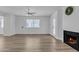 Living room with fireplace, wood floors and large glass doors for natural light at 745 N Dobson Rd # 144, Mesa, AZ 85201