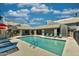 Inviting community pool with lounge chairs, perfect for relaxing and enjoying sunny days at 745 N Dobson Rd # 144, Mesa, AZ 85201