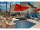 Relaxing pool area with modern lounge furniture and shaded seating at 745 N Dobson Rd # 144, Mesa, AZ 85201