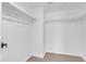 Walk-in closet features shelving and white walls and light colored wood-look flooring at 745 N Dobson Rd # 144, Mesa, AZ 85201
