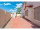 Enclosed backyard with shed, perfect for storage and privacy on a brick-paved surface at 7503 W Julie Dr, Glendale, AZ 85308