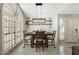 Cozy dining room with natural light, a wooden table, and seating for four, illuminated by a pendant light at 7503 W Julie Dr, Glendale, AZ 85308